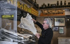 As Christmas approaches in Portugal supermarkets across the country prominently display hundreds of salt-encrusted cod piled high to be used in holiday meals