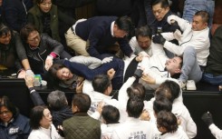 Taiwanese lawmakers tackled each other as President Lai Ching-te's party tried to block the passage of bills they say could harm the self-ruled island's 'democratic system'