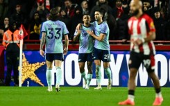 Arsenal's Gabriel Jesus (C) celebrates after scoring against Brentford