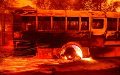 A burning bus at Aveson School of Leaders elementary school in Los Angeles County