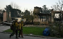 Multiple fires that continue to ravage the outskirts of Los Angeles have killed at least 11 people