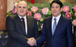 Vietnam's President Luong Cuong (right) and Russia's Prime Minister Mikhail Mishustin at the Presidential Palace in Hanoi